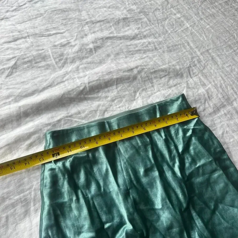 Green satin mini skirt in